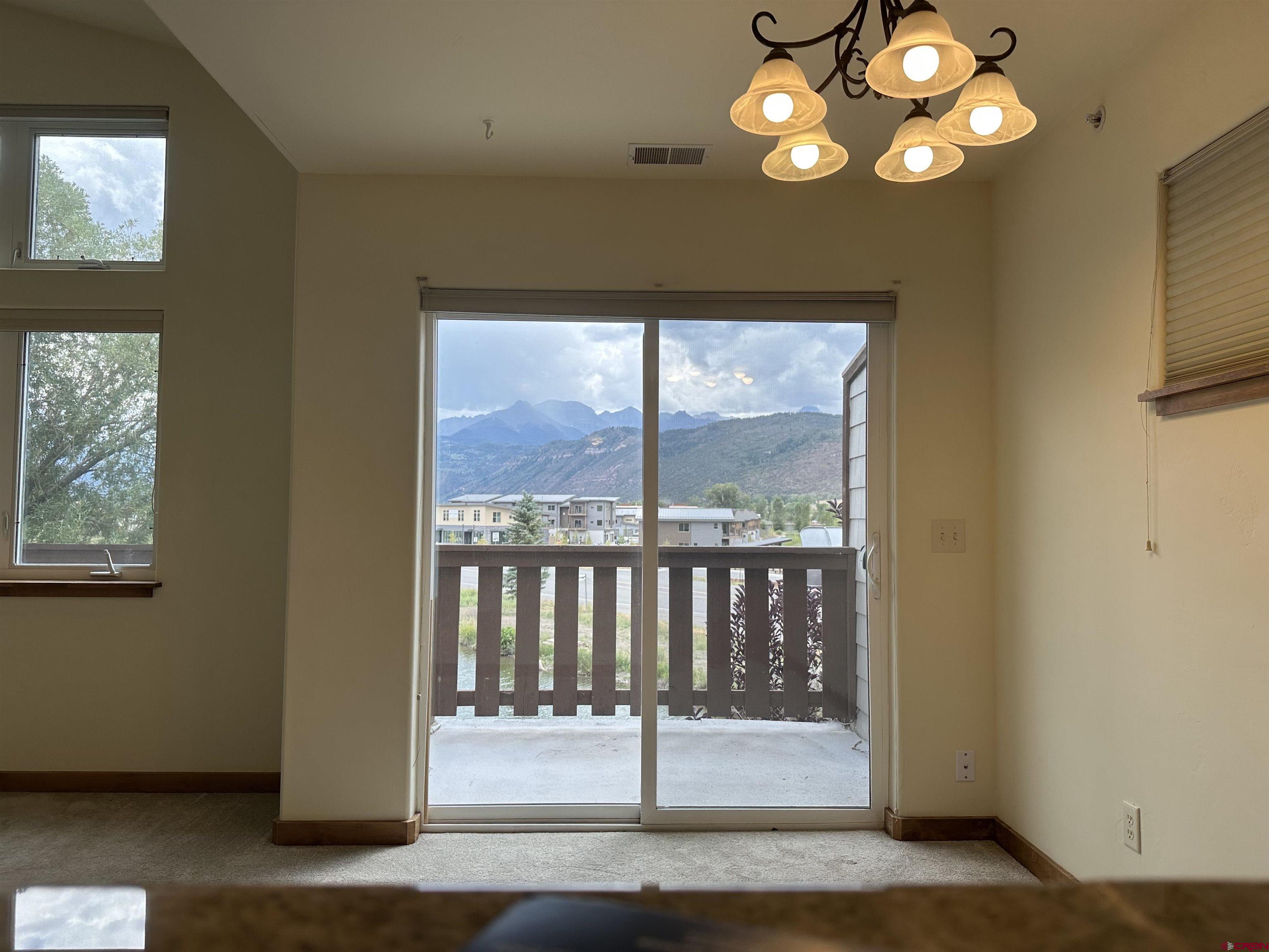 550 Redcliff Circle, Unit D202 Ridgway, CO 81432 - Photo 29 of 29 a view of a livingroom with furniture wooden floor and a window