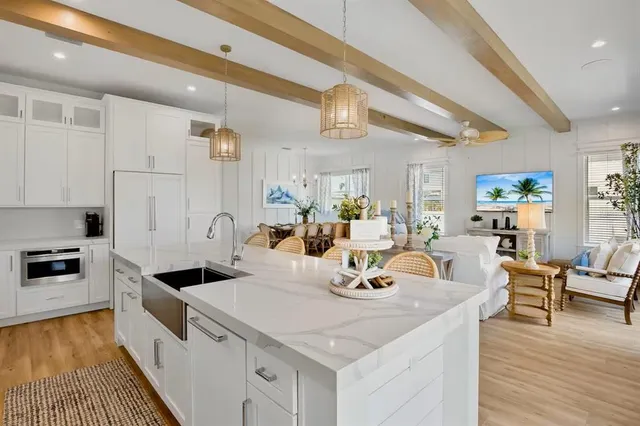 a bedroom with a bed and a potted plant