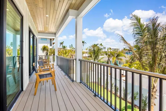 a bedroom with a bed and a flat tv screen in it