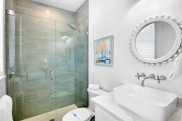 a view of a house with a small yard and sitting area