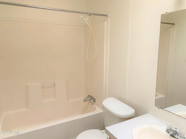 a bathroom with a shower and a toilet