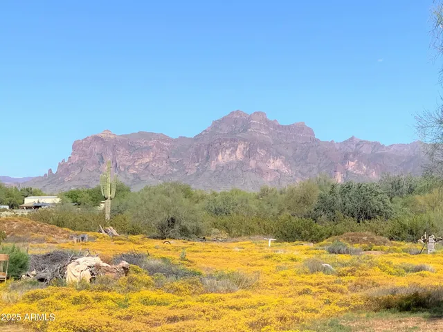 a view of a mountain with a ocean view