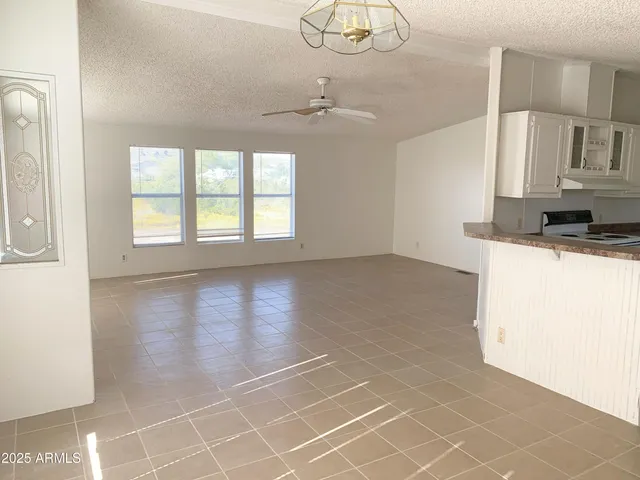 a view of a kitchen with a sink dishwasher and a refrigerator