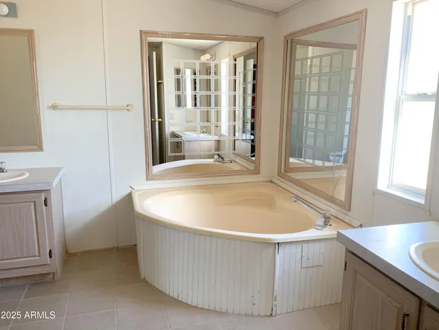 a white bath tub sitting in a bathroom