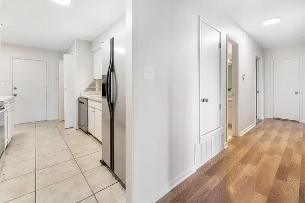 a view of a kitchen with refrigerator and oven