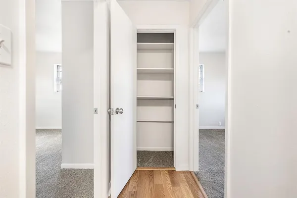 a view of a bedroom from a hallway
