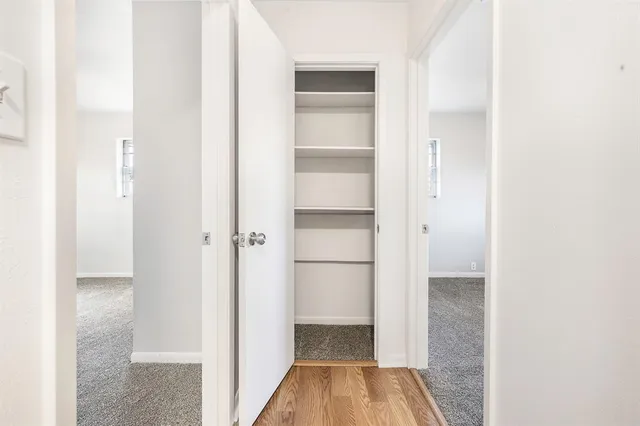 a view of a bedroom from a hallway