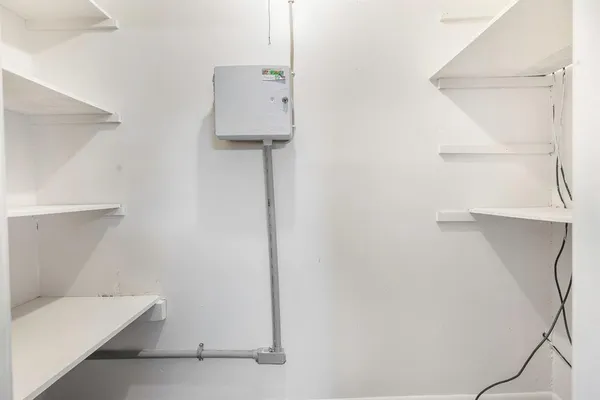 a room with a white wall and a table