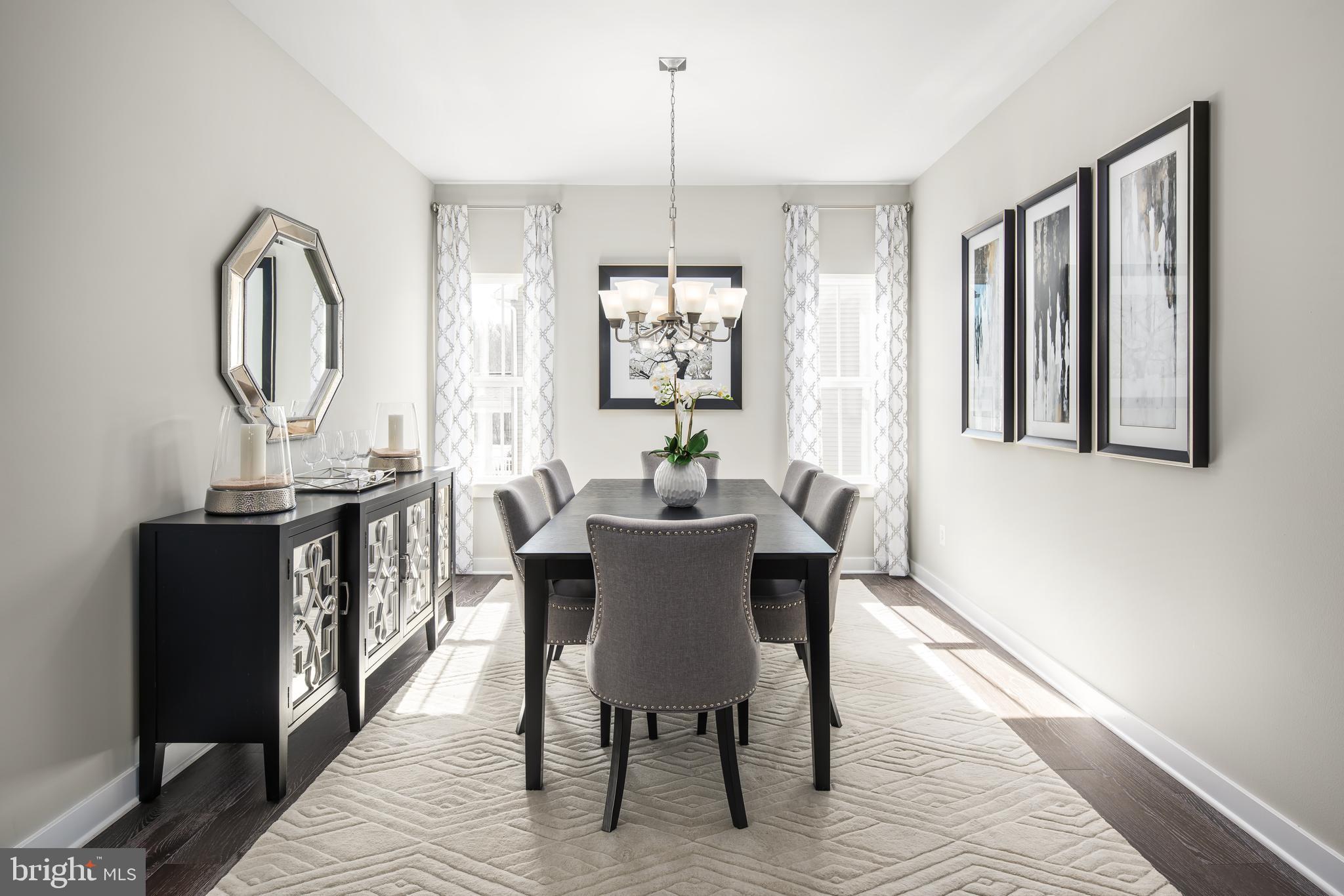 52 Wallace Way Ranson, WV 25438 - Photo 2 of 18 a view of a dining room with furniture window and wooden floor