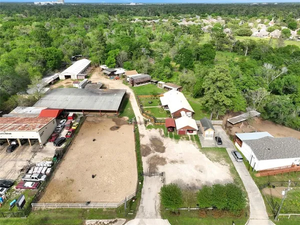 an aerial view of a house with yard swimming pool and outdoor seating