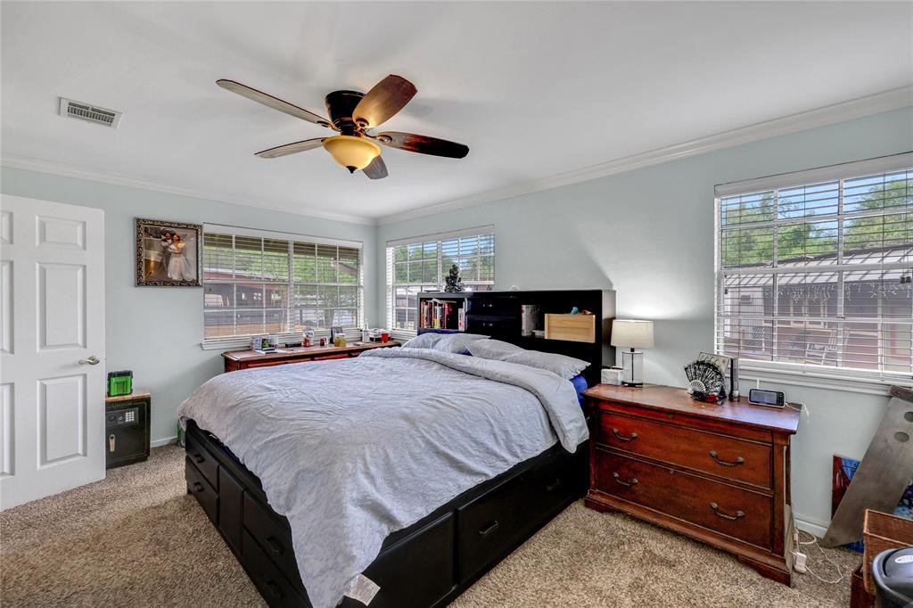 11350 Grant Road Cypress, TX 77429 - Photo 12 of 41 a bedroom with a bed and window