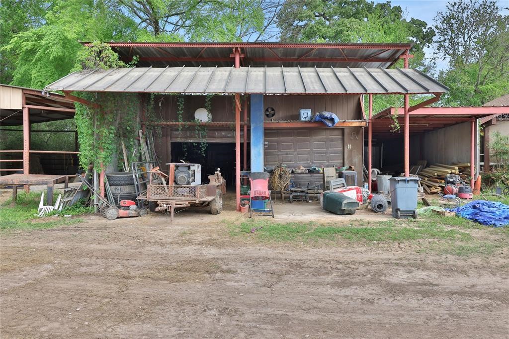 11350 Grant Road Cypress, TX 77429 - Photo 31 of 41 a view of a patio with table and chairs under an umbrella