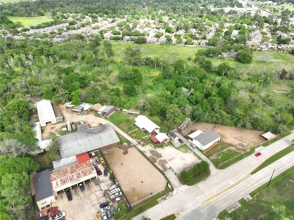 an aerial view of a house with yard swimming pool and outdoor seating