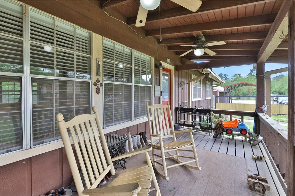 11350 Grant Road Cypress, TX 77429 - Photo 7 of 41 a view of a dining room with furniture wooden floor and a chandelier