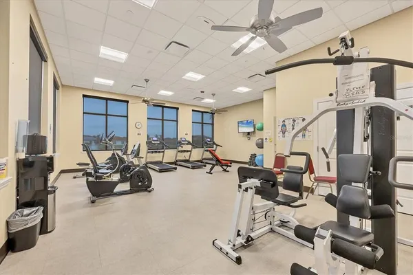 a living room with furniture gym equipment and a view of living room