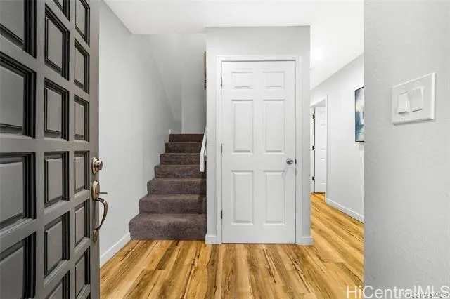 a view of entryway with wooden floor