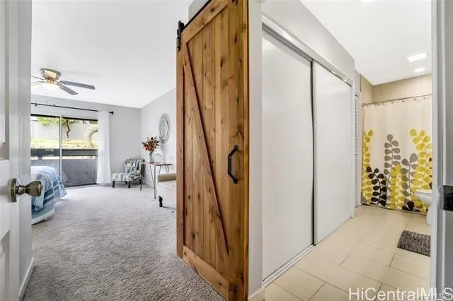 a view of a livingroom with furniture and windows