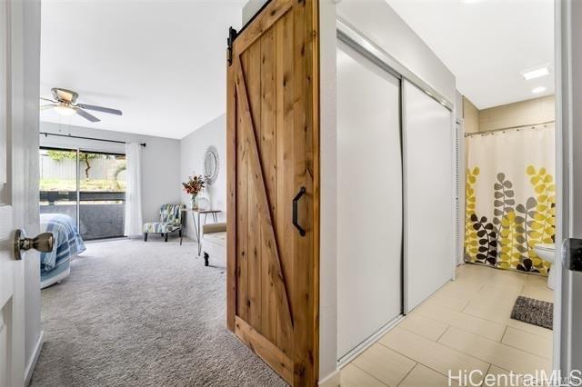 47-261 Hui Iwa Street, Unit 64 Kaneohe, HI 96744 - Photo 12 of 21 a view of a livingroom with furniture and windows