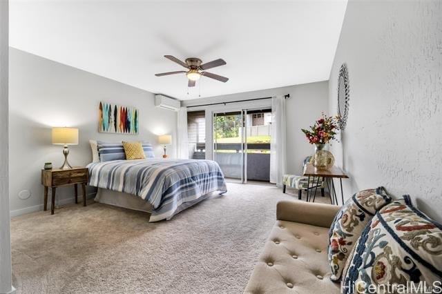 47-261 Hui Iwa Street, Unit 64 Kaneohe, HI 96744 - Photo 14 of 21 a bedroom with a bed and a couch
