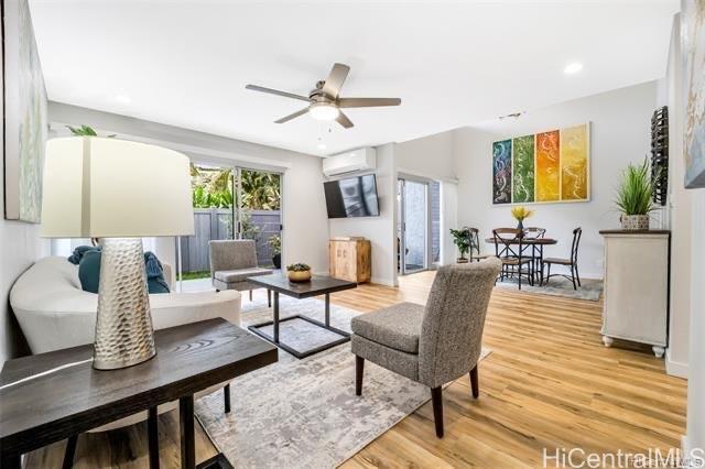 47-261 Hui Iwa Street, Unit 64 Kaneohe, HI 96744 - Photo 3 of 21 a living room with furniture and a wooden floor