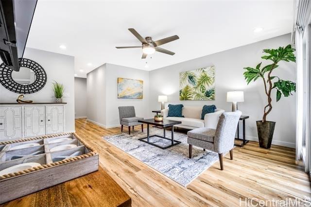 47-261 Hui Iwa Street, Unit 64 Kaneohe, HI 96744 - Photo 4 of 21 a living room with furniture and a wooden floor