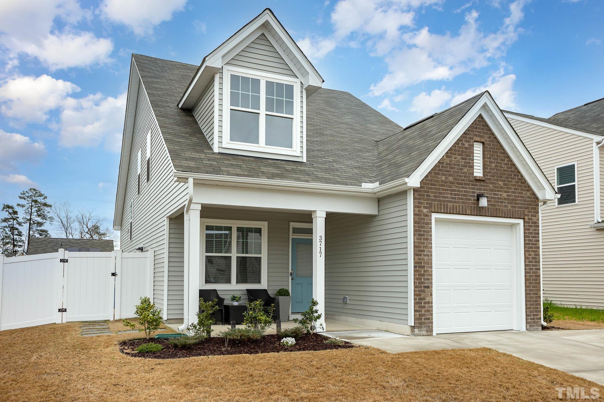 3717 Putman Road Raleigh, NC 27610 - Photo 3 of 26 a front view of a house with large windows
