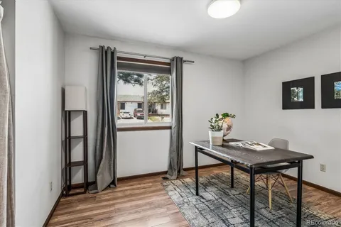 a view of a livingroom with furniture and a window