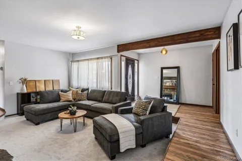 a living room with furniture and a rug