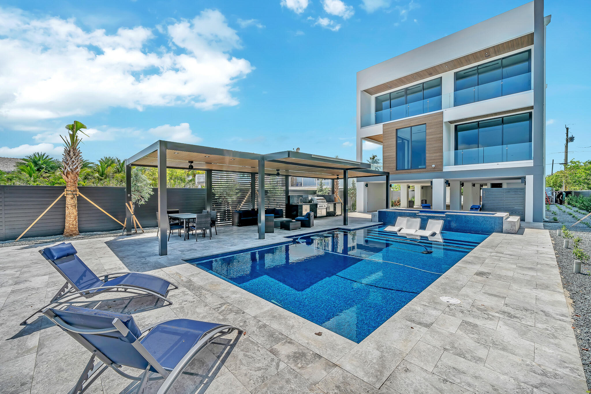 16 Seaside Avenue Key Largo, FL 33037 - Photo 121 of 140 a view of a patio with couches table and chairs and potted plants