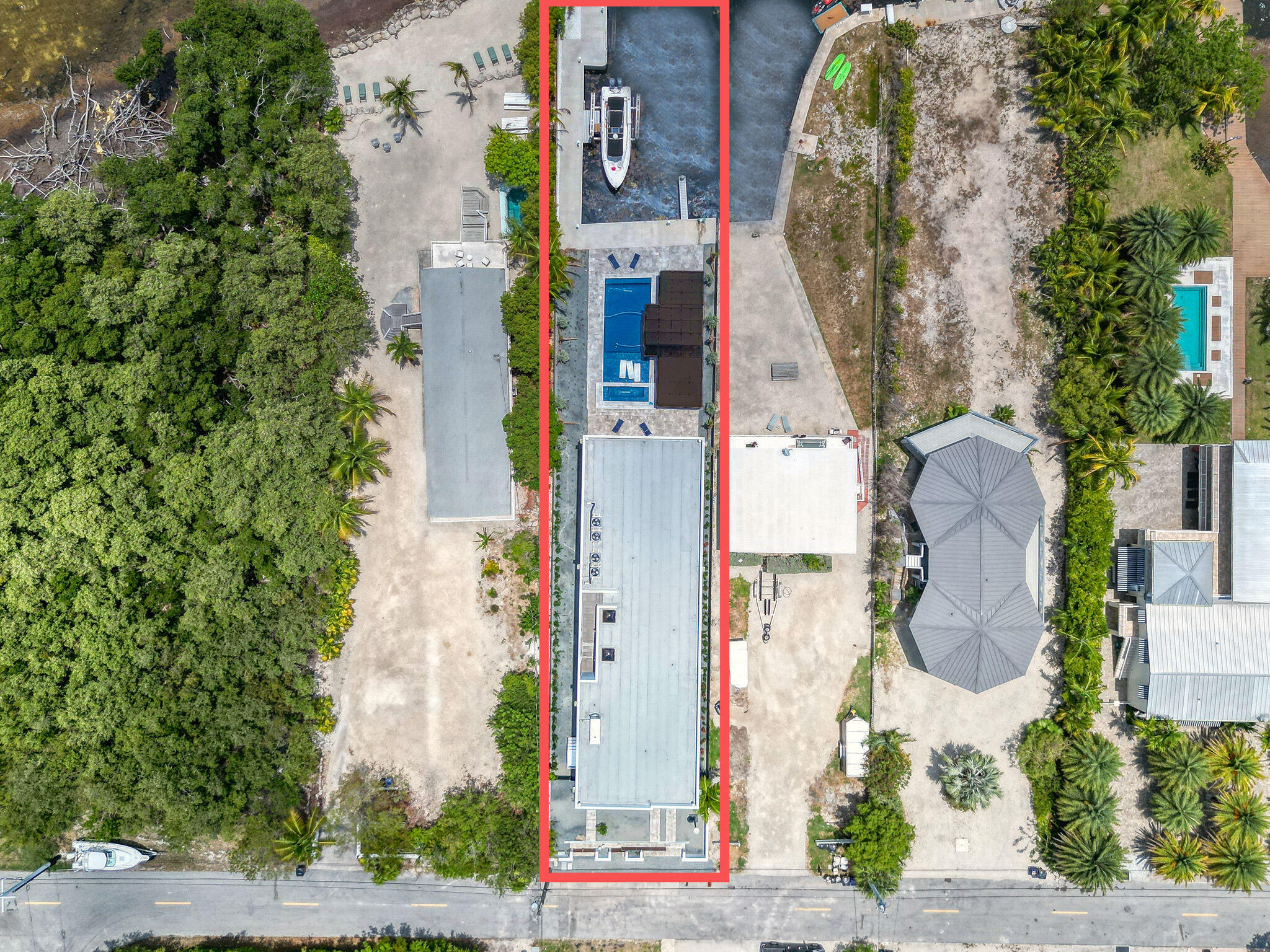 16 Seaside Avenue Key Largo, FL 33037 - Photo 135 of 140 an aerial view of a residential apartment building with a yard and potted plants