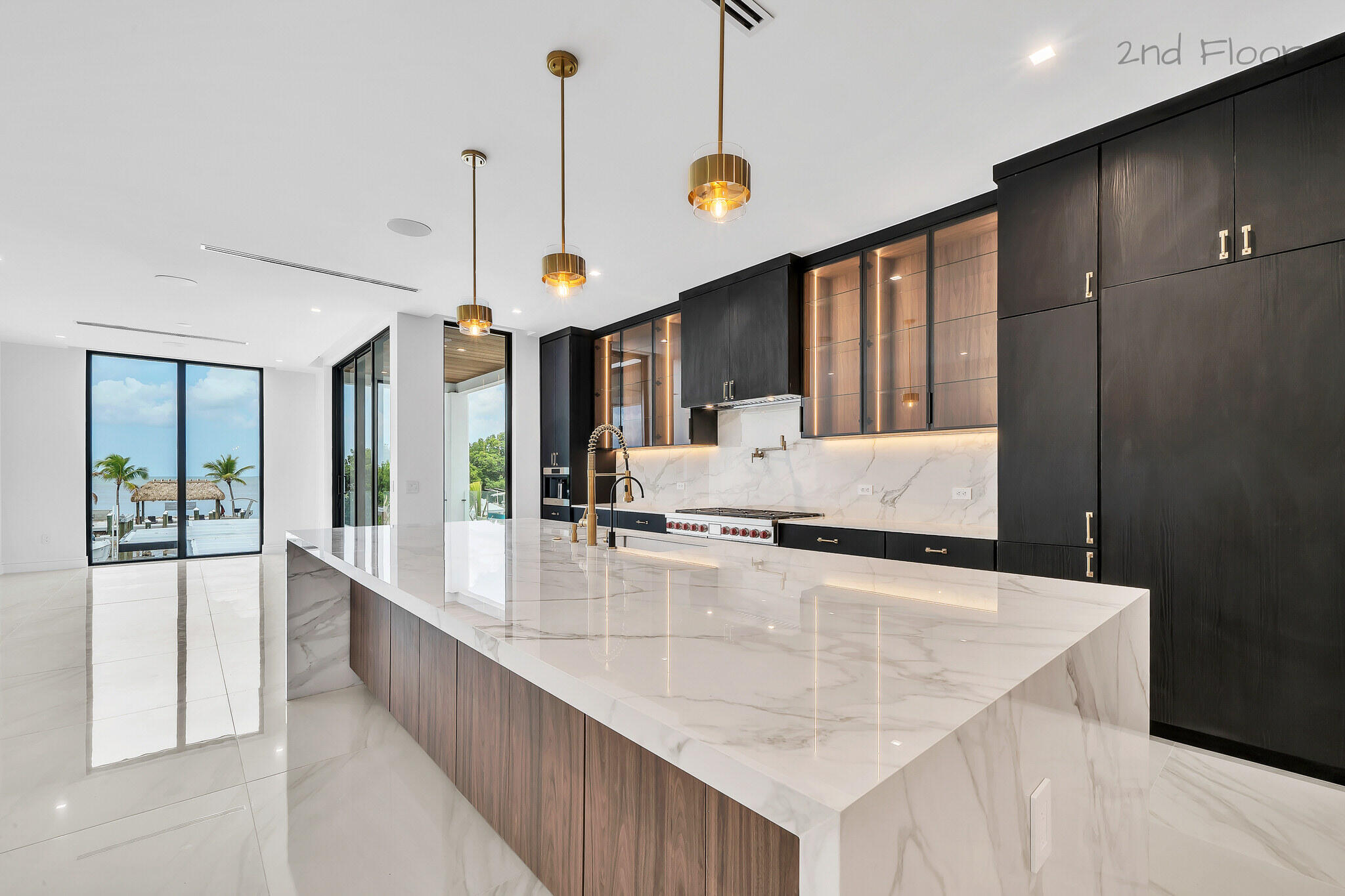 16 Seaside Avenue Key Largo, FL 33037 - Photo 17 of 140 a large kitchen with kitchen island a large counter top a large window and furniture