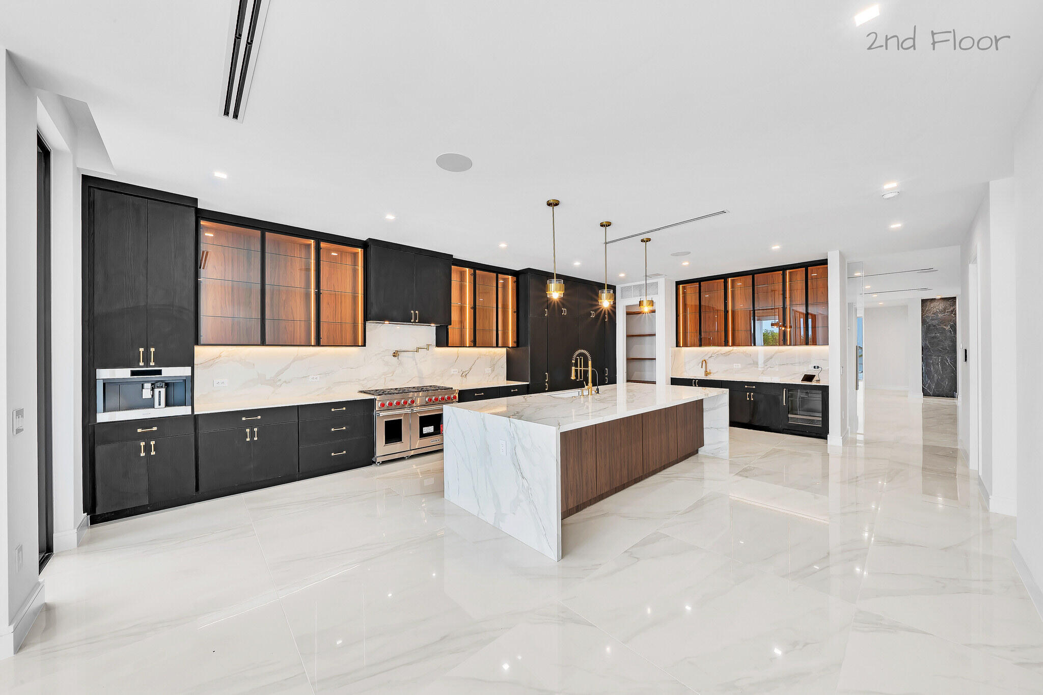 16 Seaside Avenue Key Largo, FL 33037 - Photo 20 of 140 a large white kitchen with a large counter top sink and stainless steel appliances