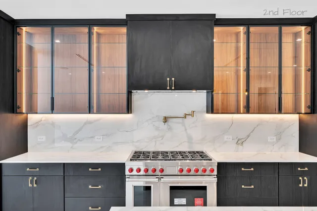 a view of kitchen with furniture and refrigerator