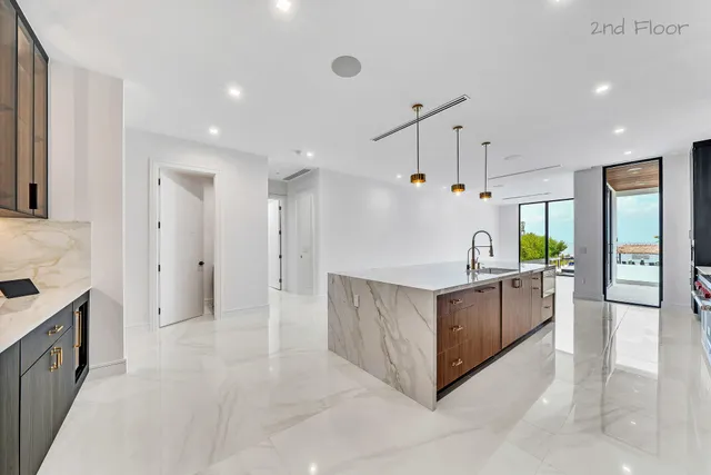 a bathroom with a bathtub and double vanity