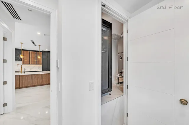 a view of an empty room with glass door