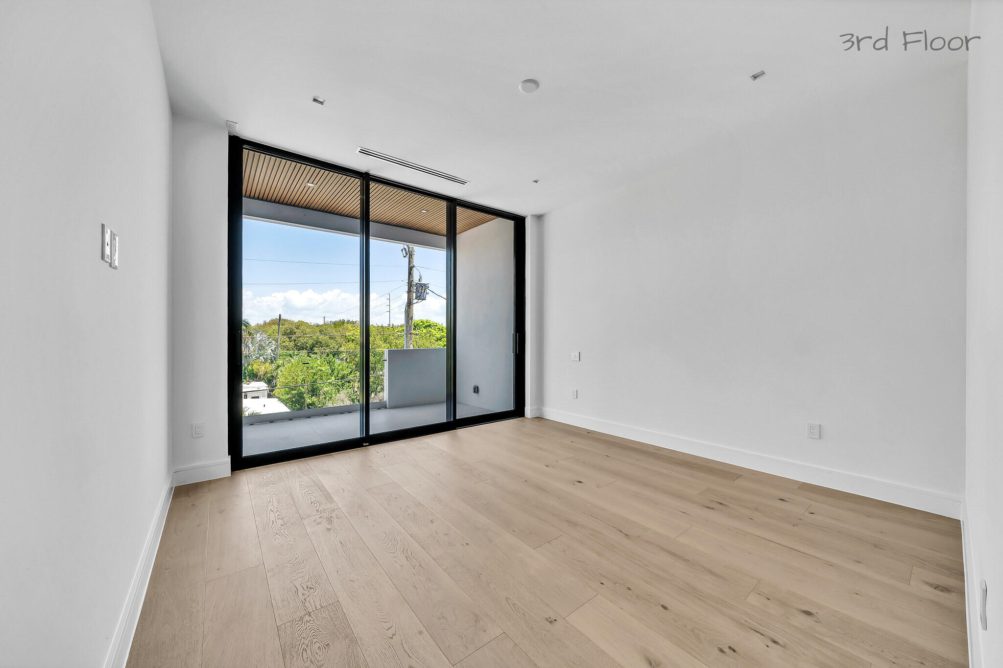 16 Seaside Avenue Key Largo, FL 33037 - Photo 77 of 140 a view of an empty room with wooden floor and a window