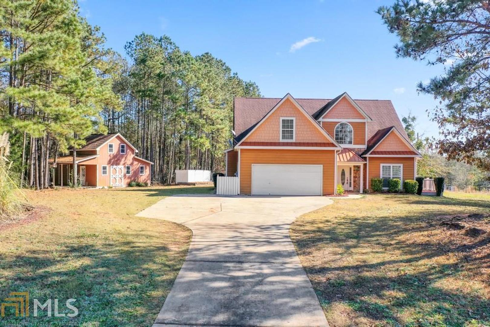 102 High Ridge Trail Jackson, GA 30233 - Photo 1 of 1 a front view of a house with a yard and garage