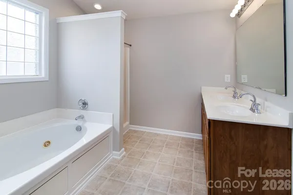 a bathroom with a bathtub and a sink