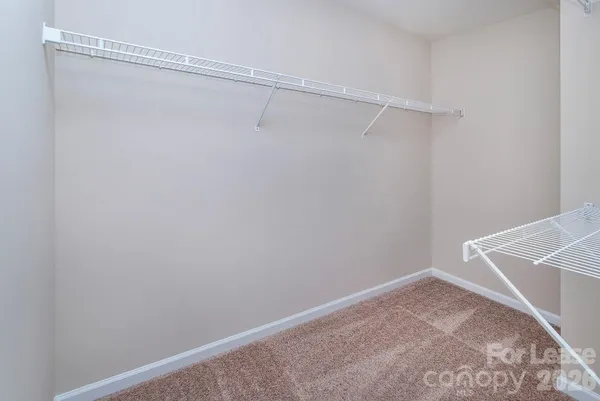 a view of a room with racks on the wall