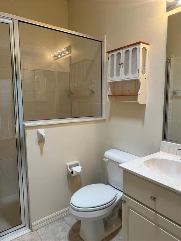 11145 Northwest 17th Court Road Ocala, FL 34475 - Photo 33 of 59 a bathroom with a toilet a sink and shower