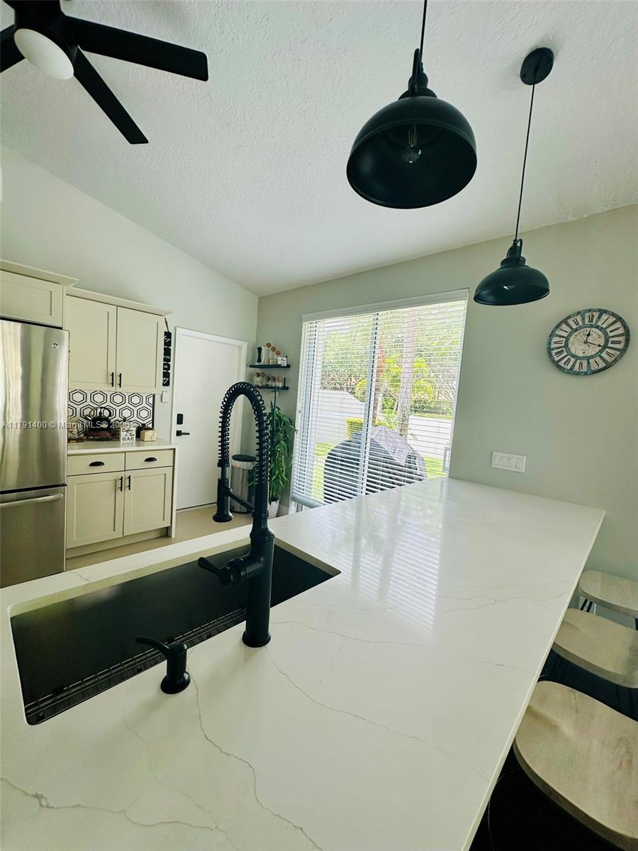 3961 Antigua Point Drive Boca Raton, FL 33487 - Photo 13 of 65 a kitchen with a refrigerator a sink and a stove