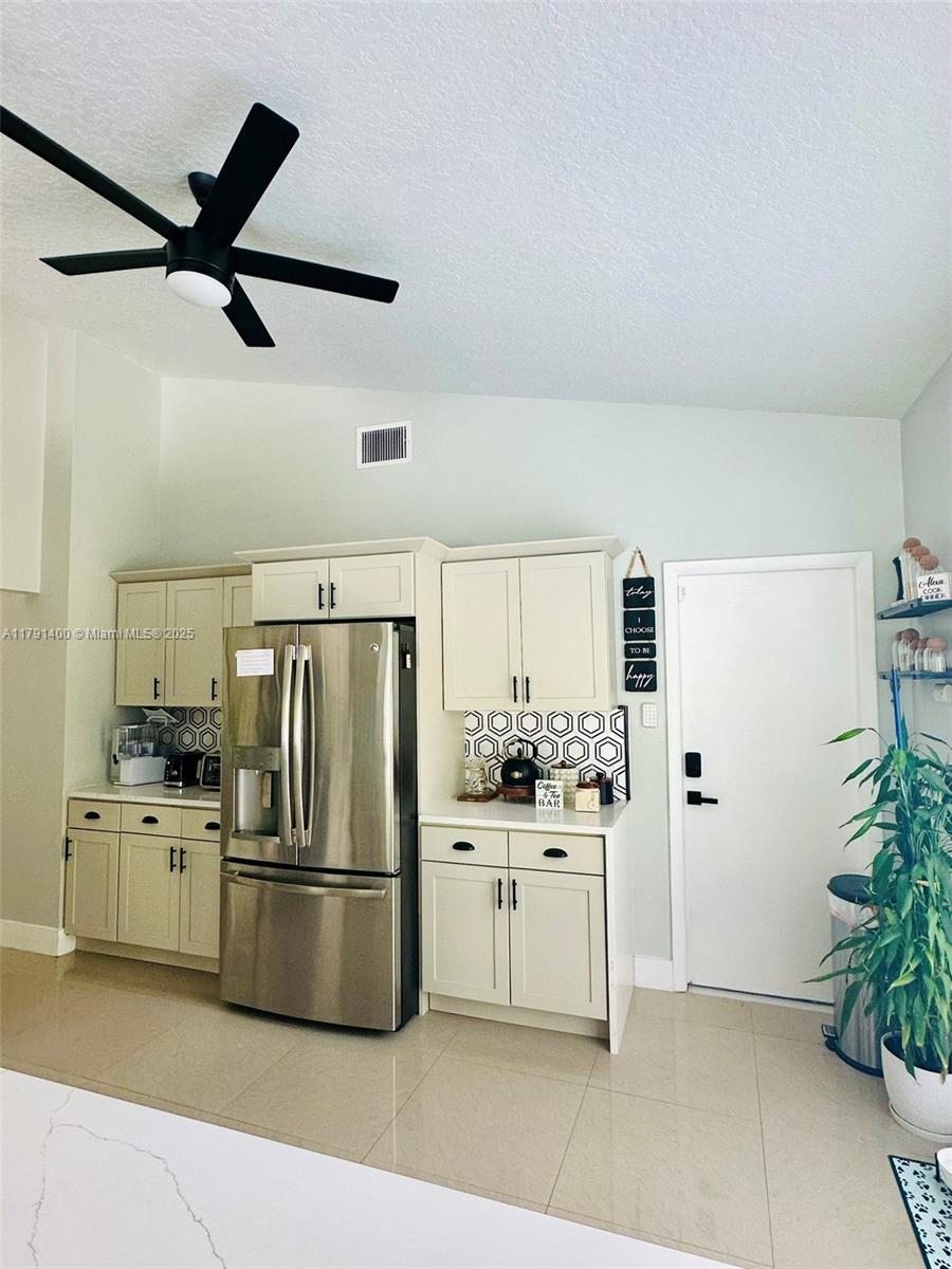 3961 Antigua Point Drive Boca Raton, FL 33487 - Photo 15 of 65 a kitchen with stainless steel appliances a refrigerator sink and stove