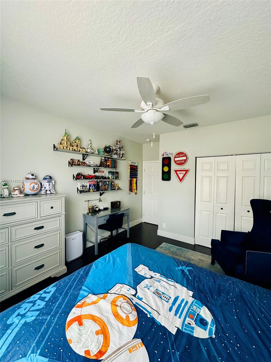 3961 Antigua Point Drive Boca Raton, FL 33487 - Photo 26 of 65 a living room with furniture and a wooden floor