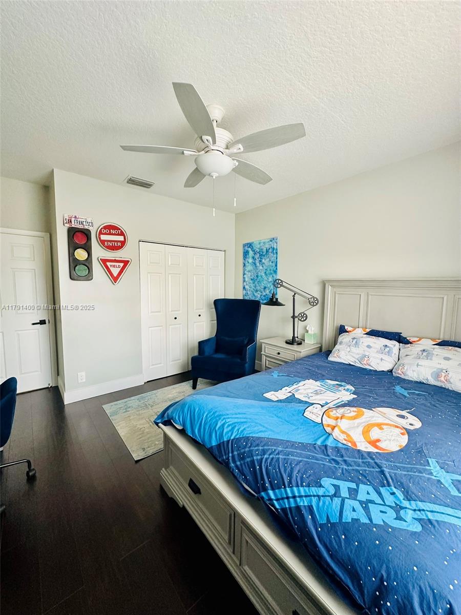 3961 Antigua Point Drive Boca Raton, FL 33487 - Photo 27 of 65 a bedroom with a bed and a table in it
