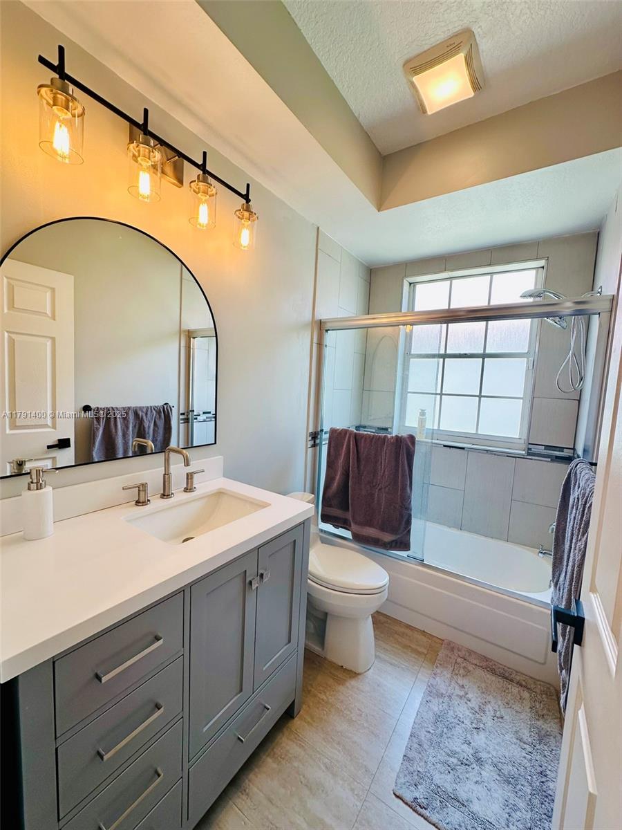 3961 Antigua Point Drive Boca Raton, FL 33487 - Photo 29 of 65 a bathroom with a toilet a sink and bathtub