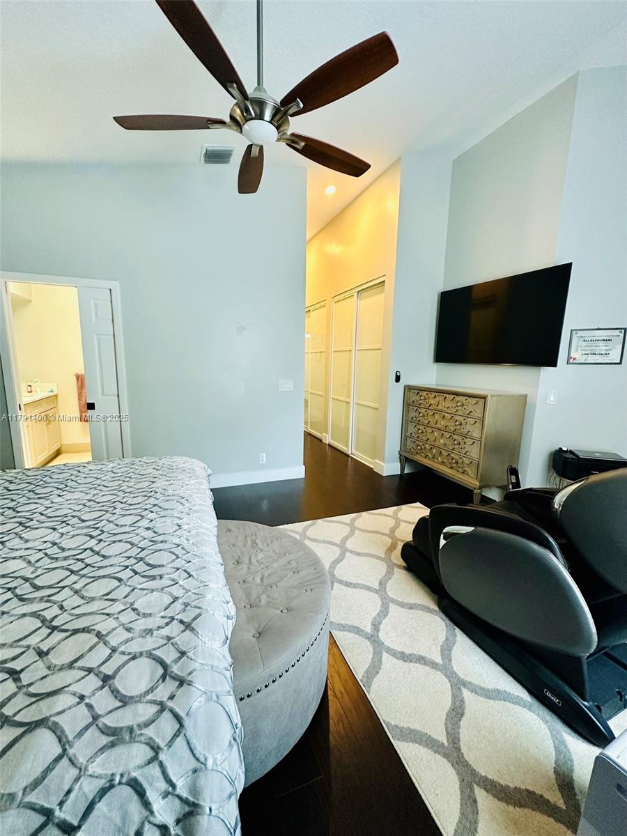 3961 Antigua Point Drive Boca Raton, FL 33487 - Photo 33 of 65 a bedroom with a bed and a flat screen tv