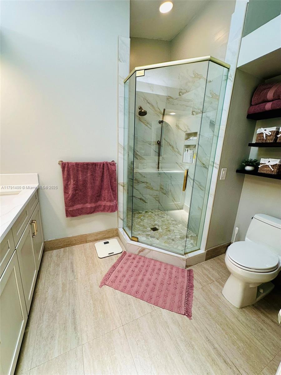 3961 Antigua Point Drive Boca Raton, FL 33487 - Photo 38 of 65 a bathroom with a sink and a shower
