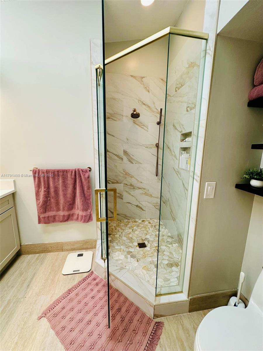3961 Antigua Point Drive Boca Raton, FL 33487 - Photo 40 of 65 a bathroom with a shower and a toilet