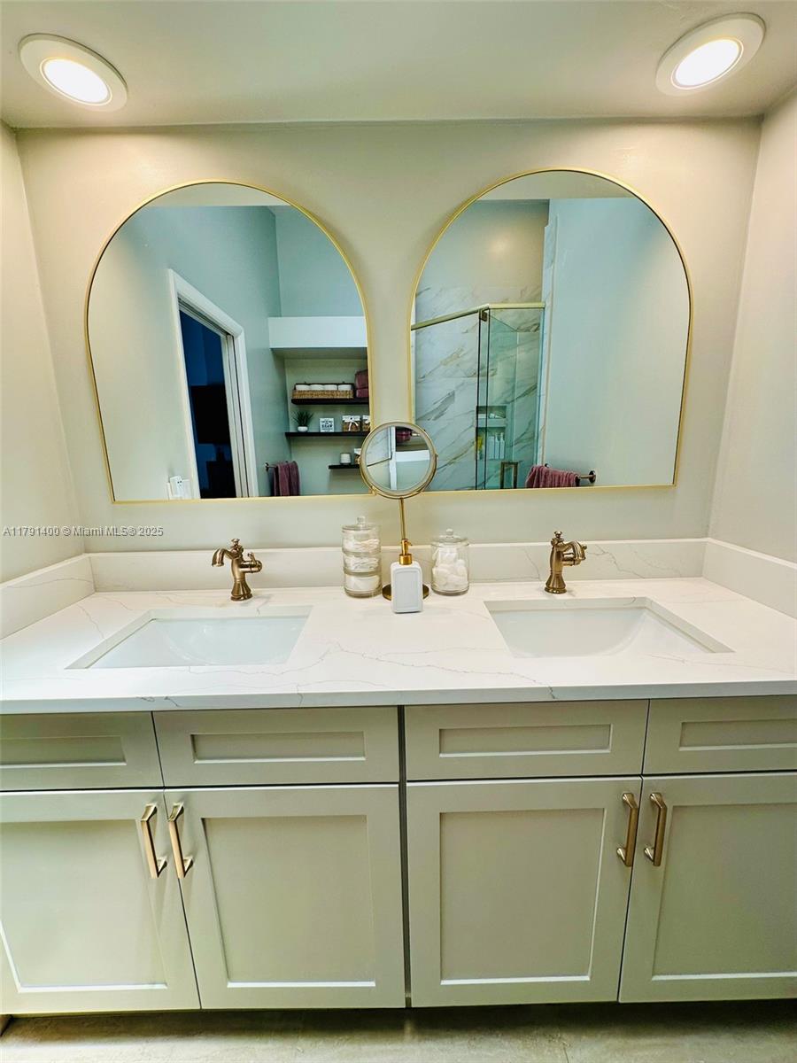 3961 Antigua Point Drive Boca Raton, FL 33487 - Photo 41 of 65 a bathroom with a sink and a mirror