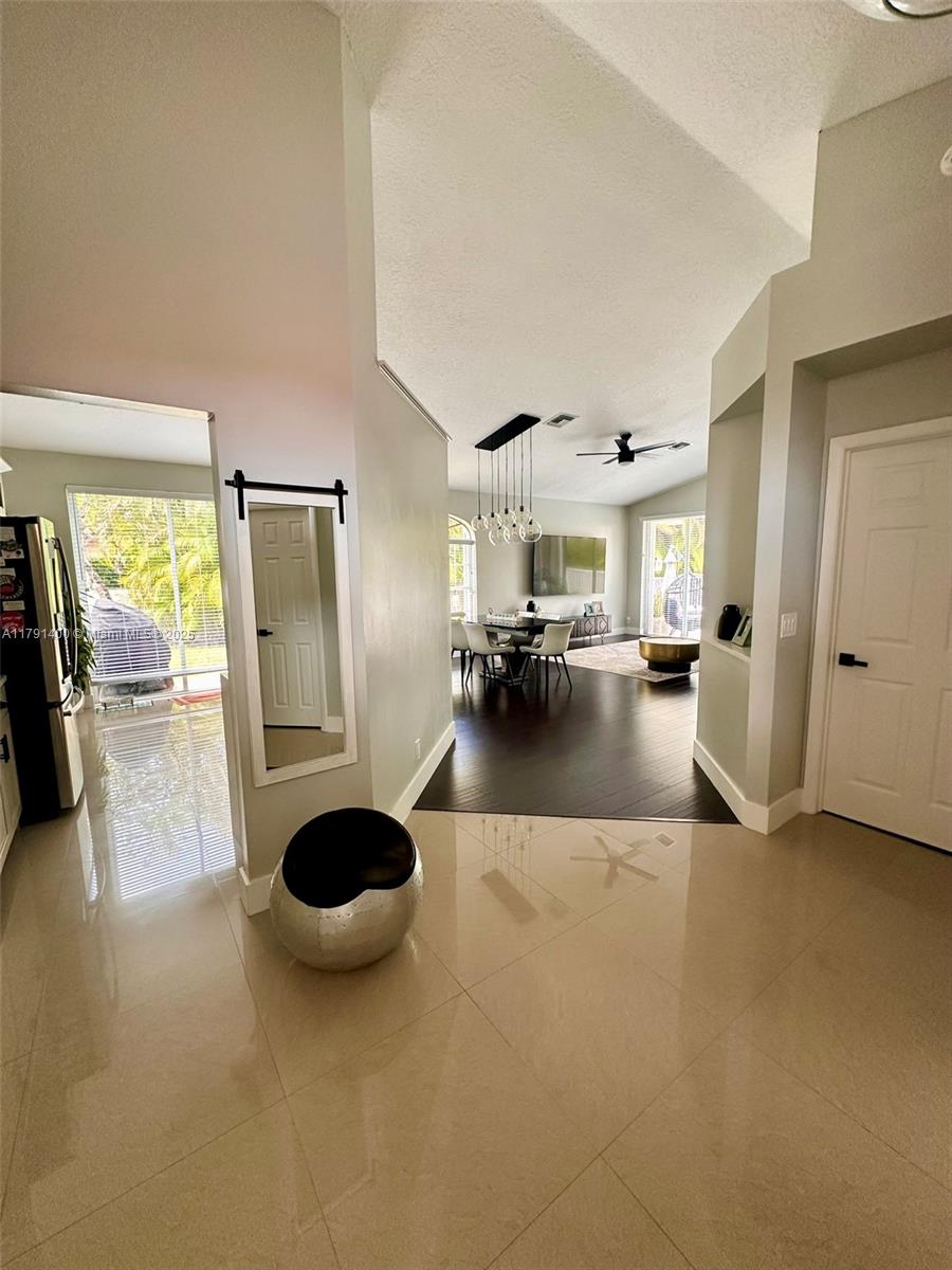 3961 Antigua Point Drive Boca Raton, FL 33487 - Photo 5 of 65 a view of living room with furniture and large windows